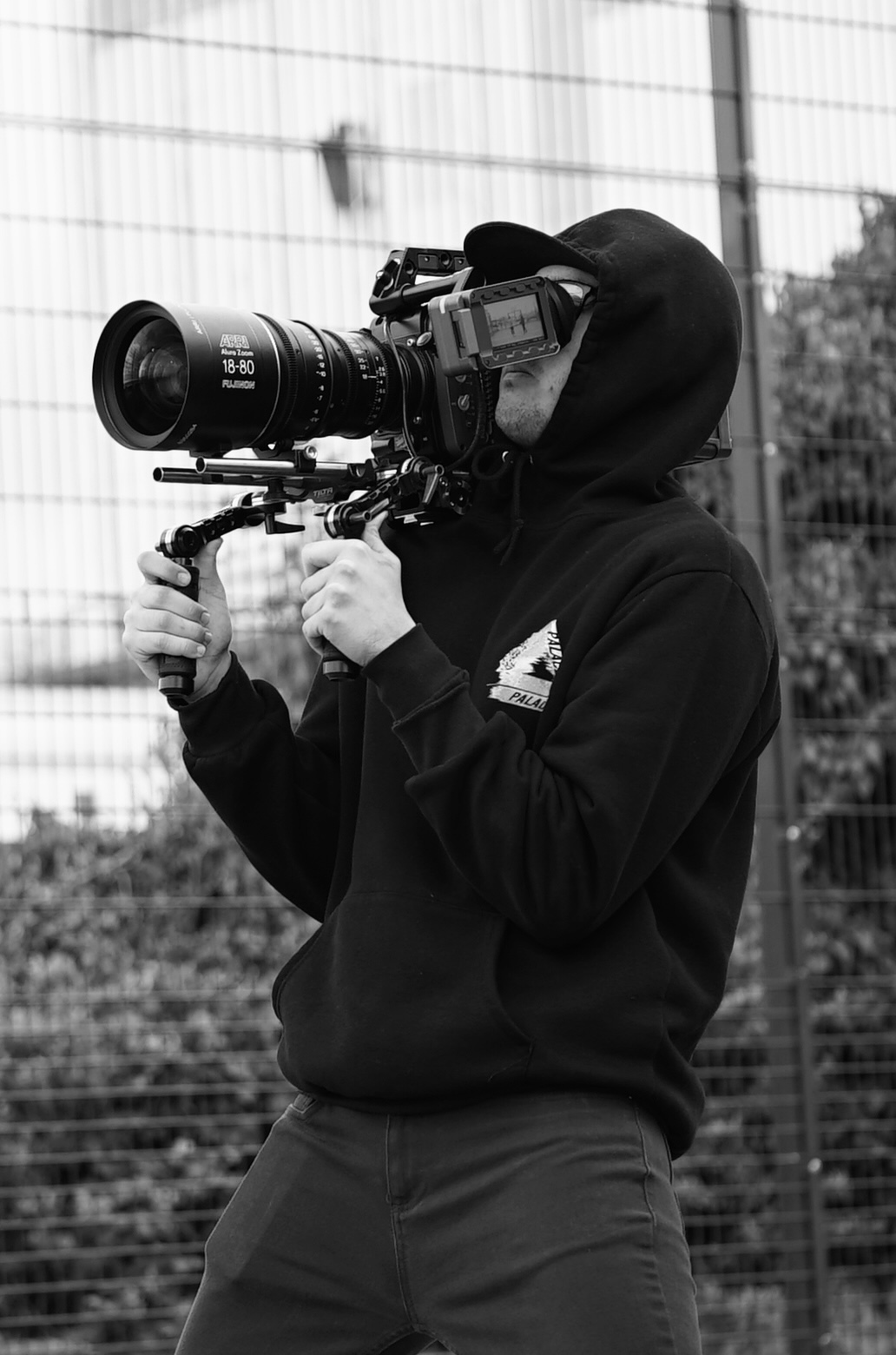 Tristan Kassam operating a cinema camera outdoors