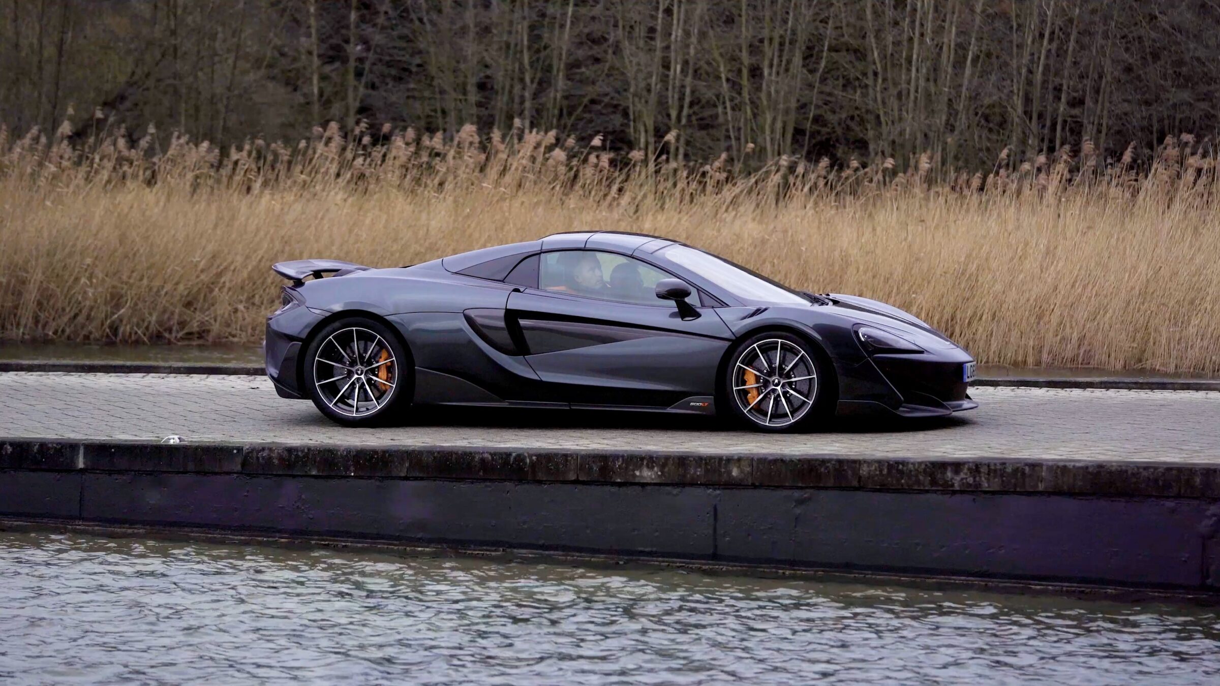 McLaren 600LT parked beside a canal